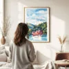 03 - Framed Hakone with Mount Fuji Watercolor Wall Art - In Living Room with Woman Looking at it - Portrait