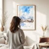 03 - Framed Hakuba Happo One Japan Watercolor Wall Art - In Living Room with Woman Looking at it - Portrait