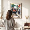 03 - Framed Hanoi Train Street Vietnam Watercolor Wall Art - In Living Room with Woman Looking at it - Portrait.jpg