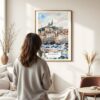 03 - Framed Marseilles Watercolor Wall Art - In Living Room with Woman Looking at it - Portrait.jpg