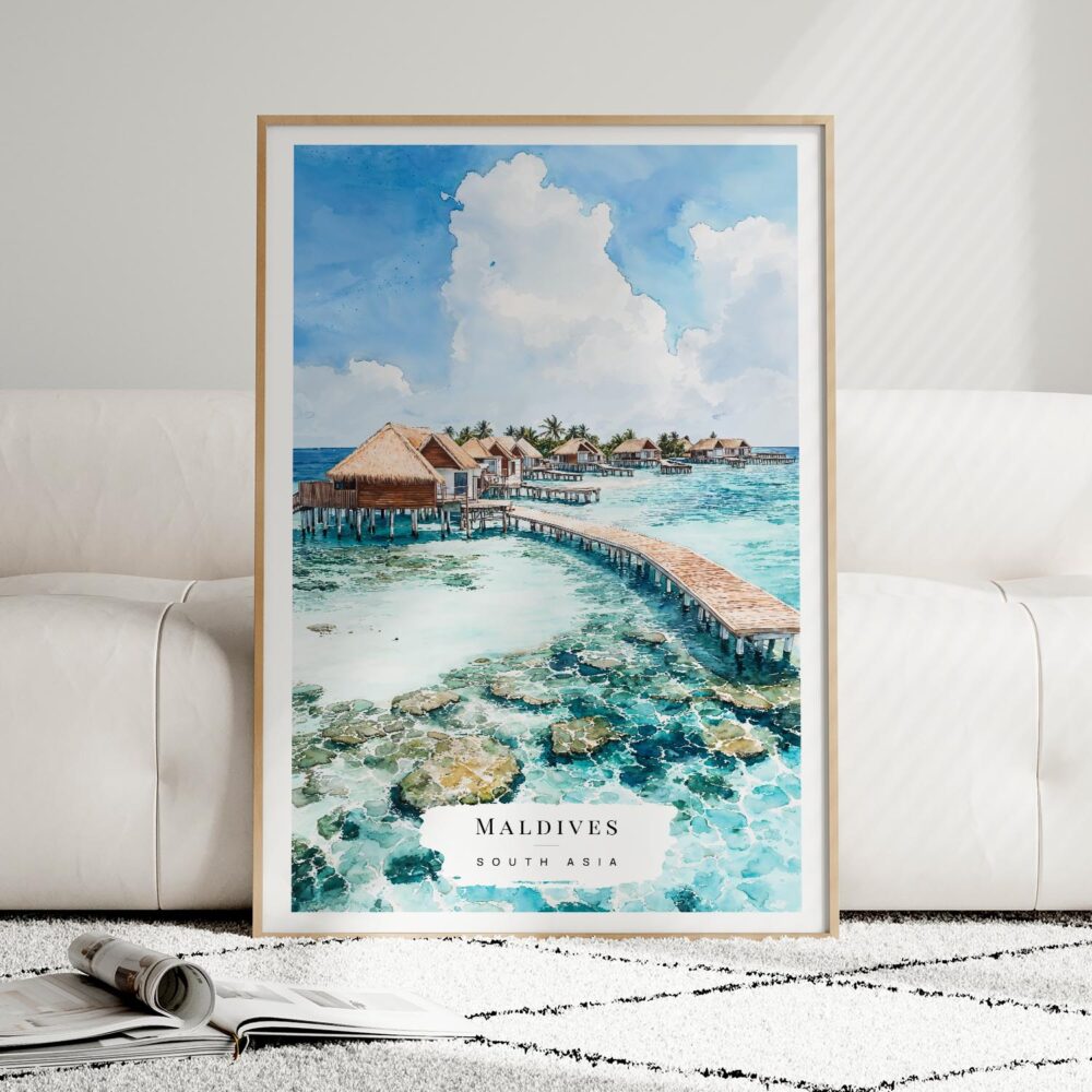 01 - Framed Maldives Watercolor Wall Art leaning against couch - Portrait.jpg 01 - Framed Maldives Watercolor Wall Art leaning against couch - Portrait.jpg