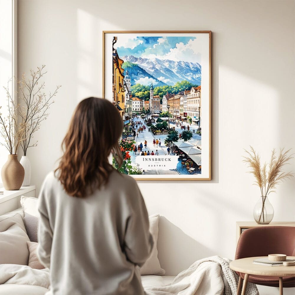 03 - Framed Innsbruck Watercolor Wall Art - In Living Room with Woman Looking at it - Portrait.jpg 03 - Framed Innsbruck Watercolor Wall Art - In Living Room with Woman Looking at it - Portrait.jpg
