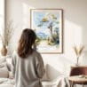 03 - Framed Isalo National Park Watercolor Wall Art - In Living Room with Woman Looking at it - Portrait.jpg