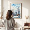03 - Framed Louisville Kentucky Watercolor Wall Art - In Living Room with Woman Looking at it - Portrait.jpg
