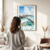 03 - Framed Maldives Watercolor Wall Art - In Living Room with Woman Looking at it - Portrait.jpg