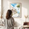 03 - Framed Mallorca Spain Watercolor Wall Art - In Living Room with Woman Looking at it - Portrait.jpg