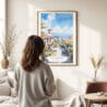 03 - Framed Santa Barbara California Watercolor Wall Art - In Living Room with Woman Looking at it - Portrait.jpg