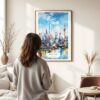 03 - Framed Shanghai China Watercolor Wall Art - In Living Room with Woman Looking at it - Portrait.jpg
