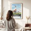 03 - Framed Montauk lighthouse Watercolor Wall Art - In Living Room with Woman Looking at it - Portrait.jpg