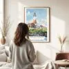 03 - Framed Montauk lighthouse Watercolor Wall Art - In Living Room with Woman Looking at it - Portrait.jpg