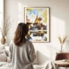 03 - Framed Chiang Mai Doi Suthep Watercolor Wall Art - In Living Room with Woman Looking at it - Portrait.jpg