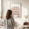 03 - Framed Jaipur Palace of the winds Watercolor Wall Art - In Living Room with Woman Looking at it - Portrait.jpg