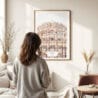 03 - Framed Jaipur Palace of the winds Watercolor Wall Art - In Living Room with Woman Looking at it - Portrait.jpg