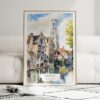 01 - Framed Bruges Belgium Watercolor Wall Art leaning against couch - Portrait.jpg