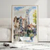 01 - Framed Bruges Belgium Watercolor Wall Art leaning against couch - Portrait.jpg