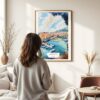 03 - Framed Monaco France Watercolor Wall Art - In Living Room with Woman Looking at it - Portrait.jpg