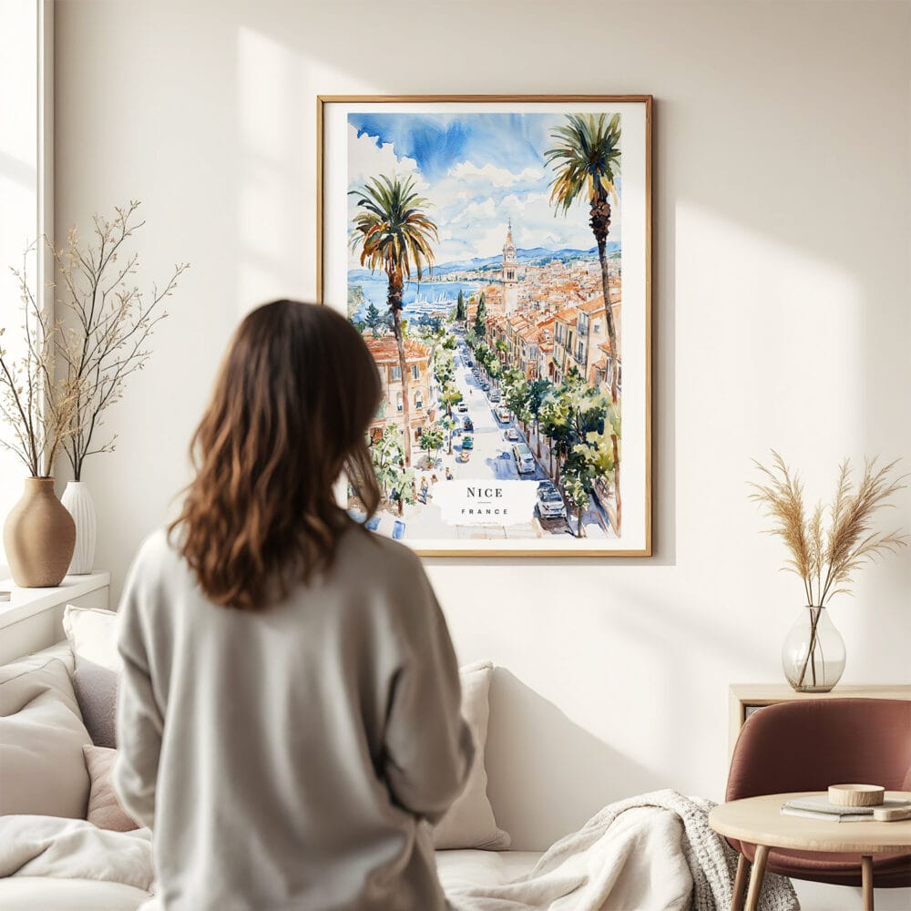 03 - Framed Nice France Watercolor Wall Art - In Living Room with Woman Looking at it - Portrait.jpg 03 - Framed Nice France Watercolor Wall Art - In Living Room with Woman Looking at it - Portrait.jpg