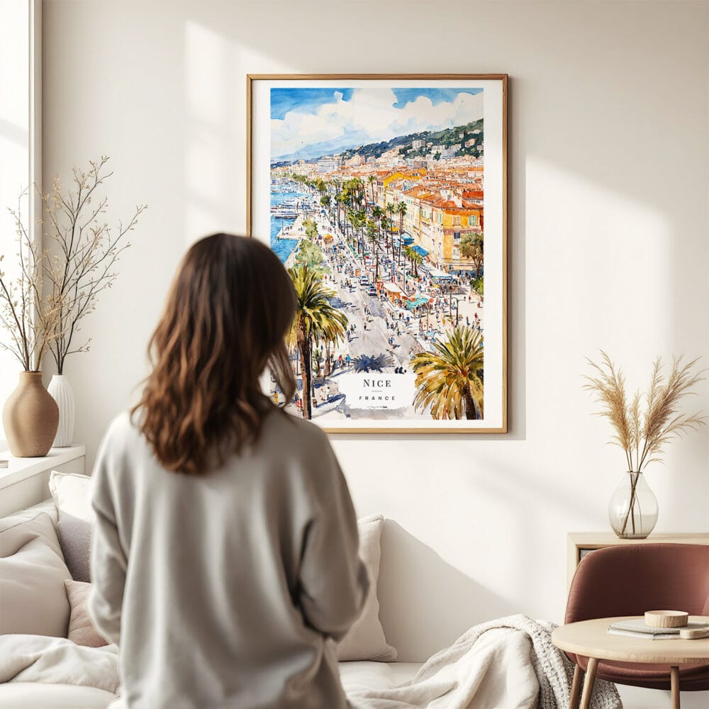 03 - Framed Nice French Riviera Watercolor Wall Art - In Living Room with Woman Looking at it - Portrait.jpg 03 - Framed Nice French Riviera Watercolor Wall Art - In Living Room with Woman Looking at it - Portrait.jpg