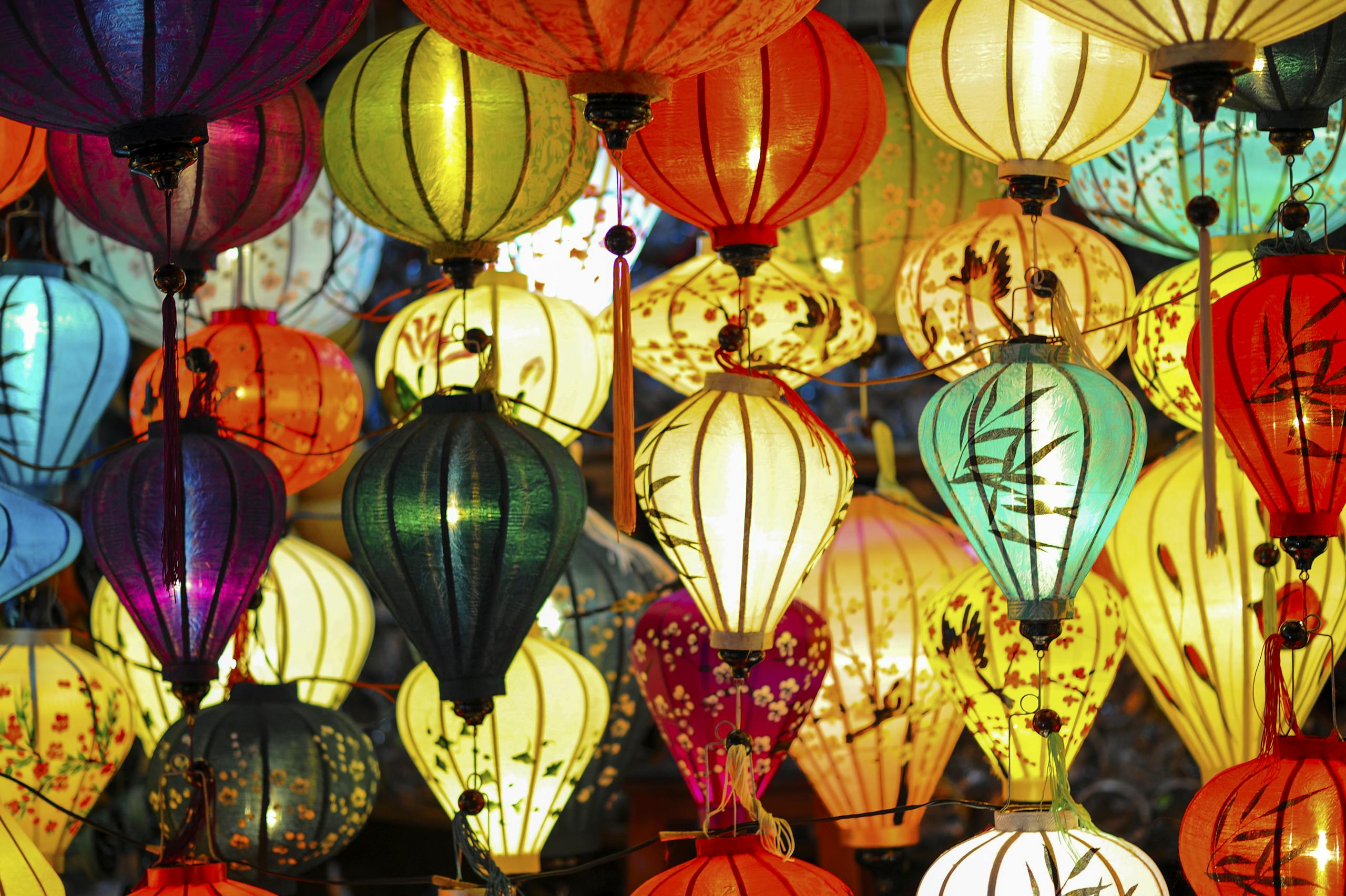 A stunning display of colorful hanging lanterns creating a festive, vibrant atmosphere.