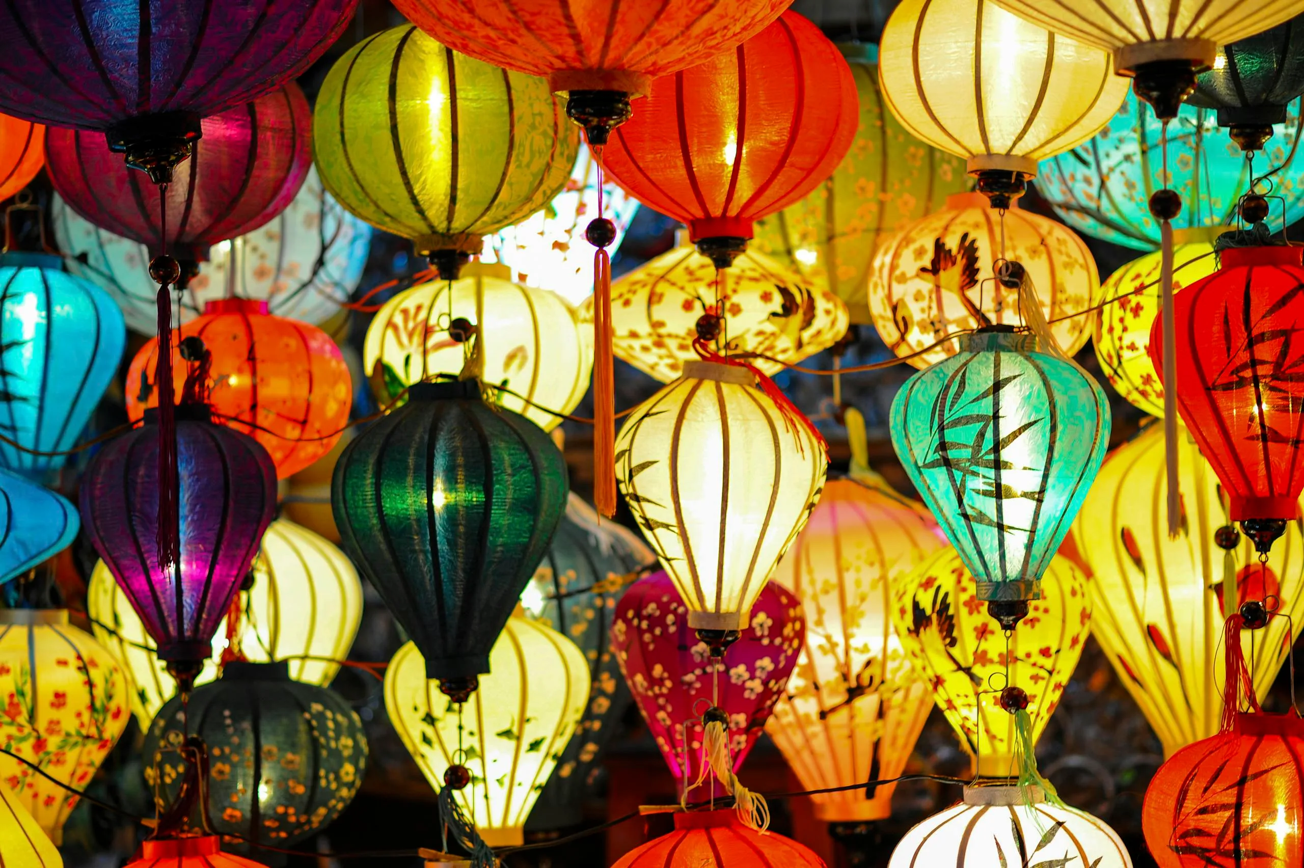 A stunning display of colorful hanging lanterns creating a festive, vibrant atmosphere.