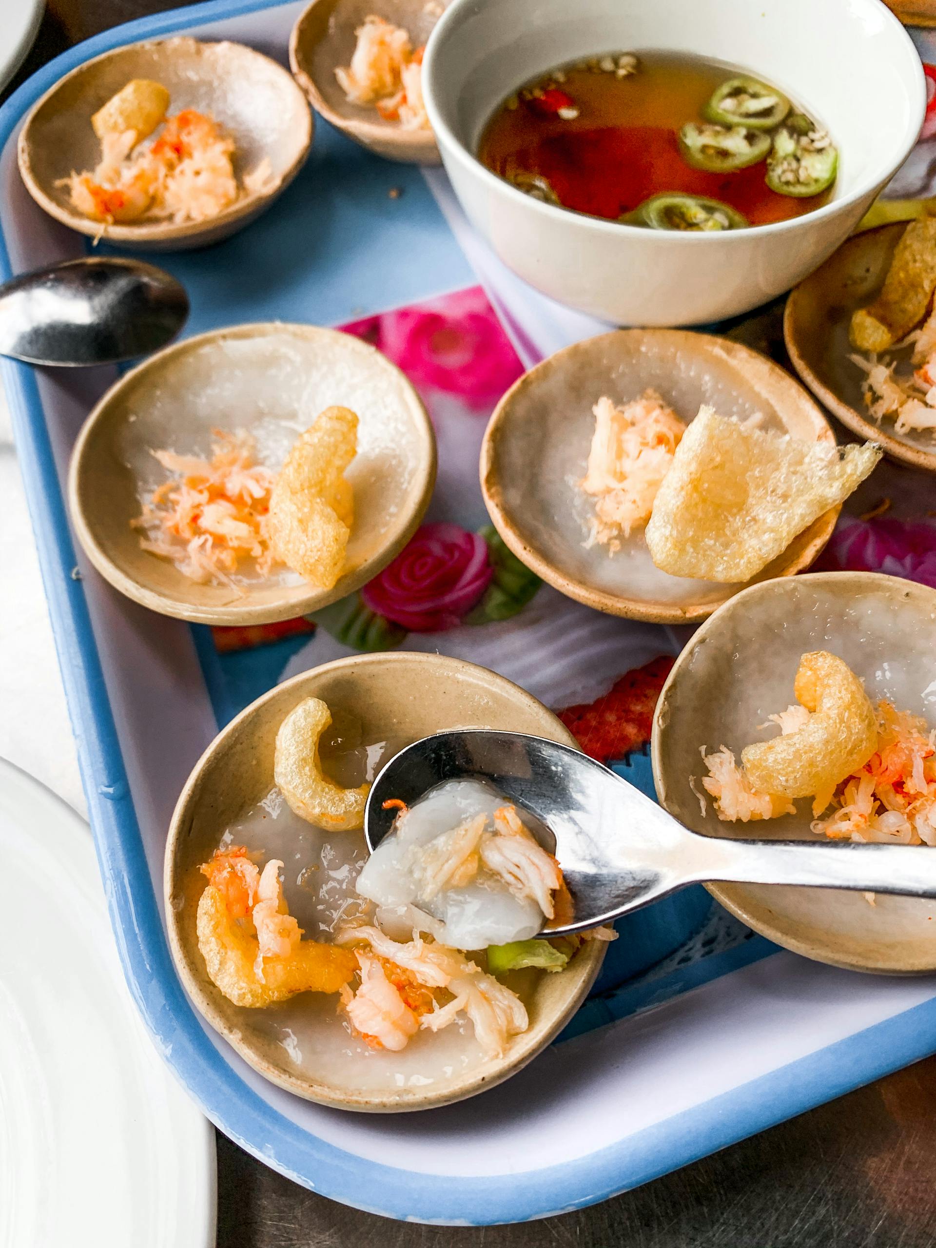 Delicious Banh Beo topped with shrimp and crispy pork, a Vietnamese delicacy from Da Nang.