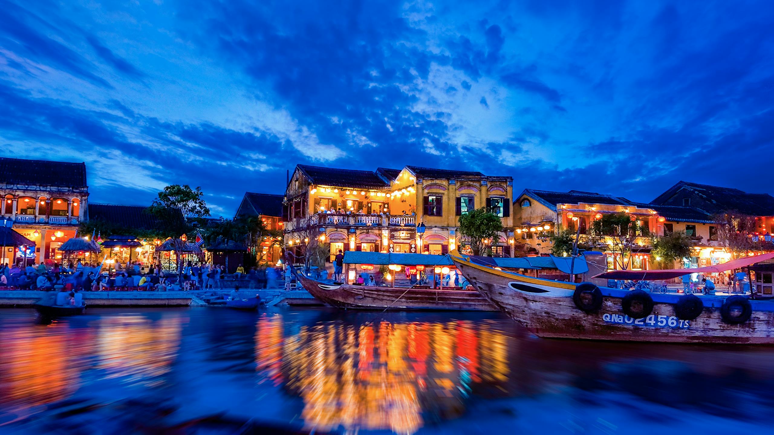 Best Cheap Places to Go on Vacation in 2025 — Budget Destinations, Sample Budgets & Money-Saving Hacks 35 Enchanting view of Hội An's riverside with colorful lights reflecting on water at night.