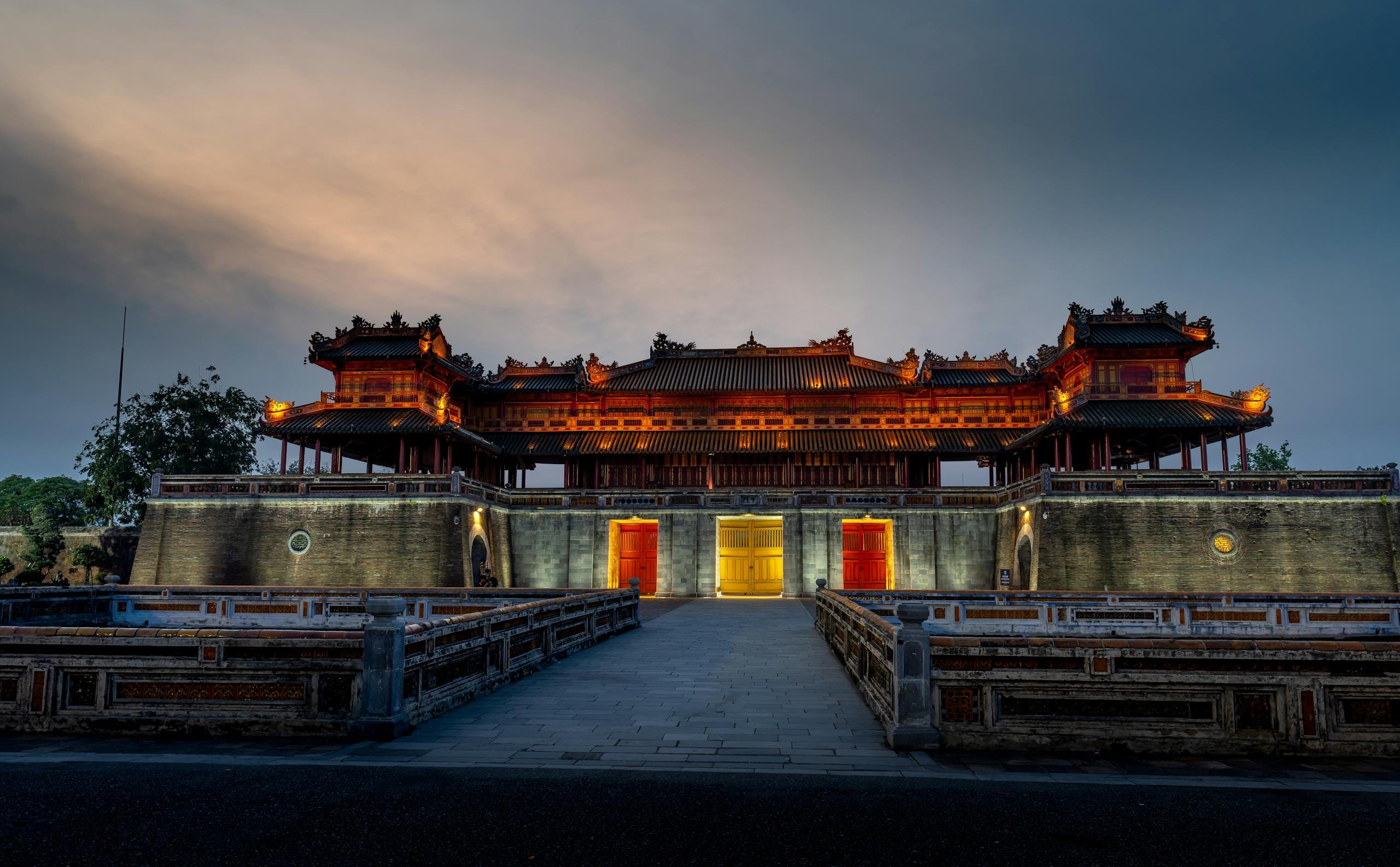 Explore the illuminated beauty of the Hue Imperial City in Vietnam, captured at twilight.