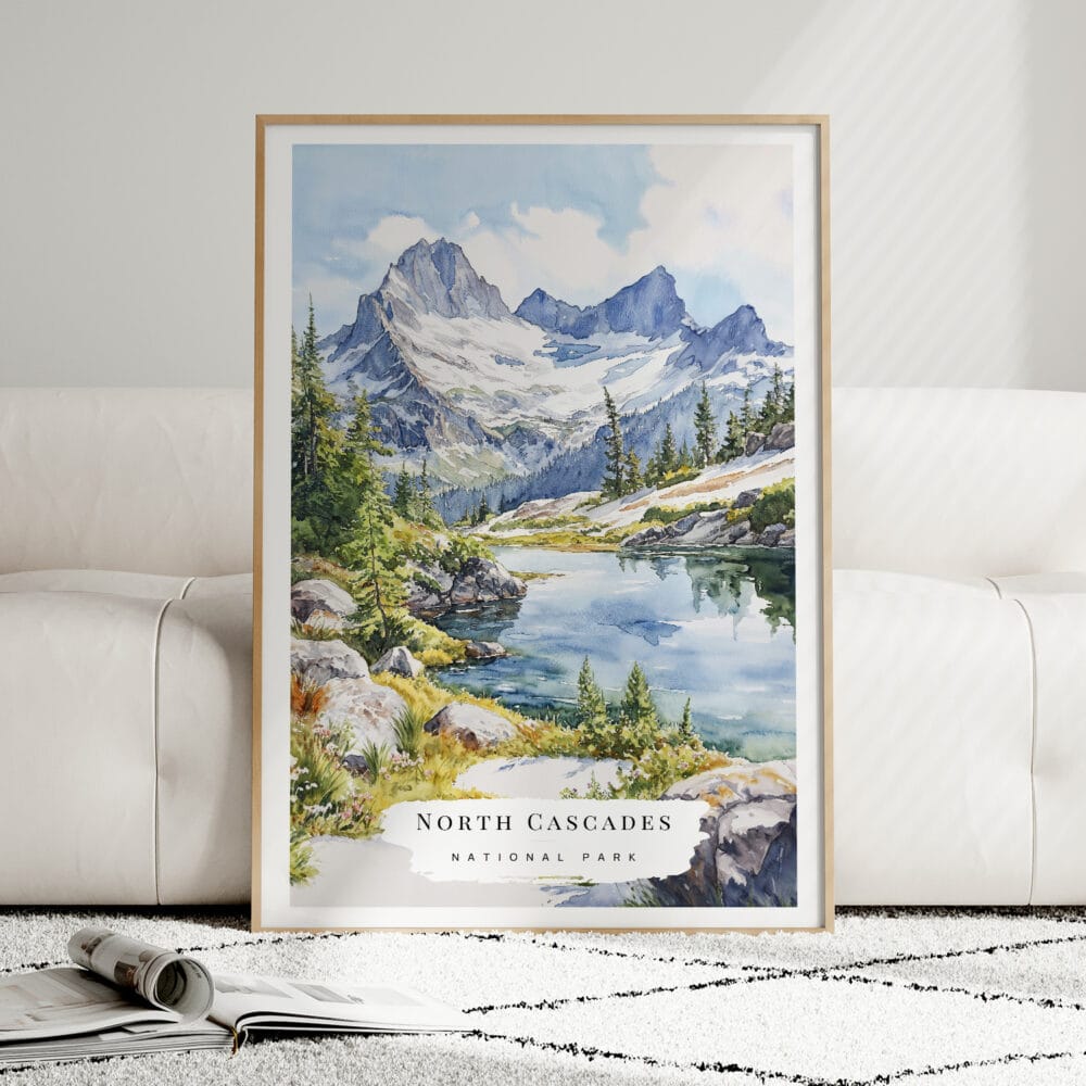 01 - Framed North Cascades National Park Watercolor Wall Art leaning against couch - Portrait.jpg 01 - Framed North Cascades National Park Watercolor Wall Art leaning against couch - Portrait.jpg
