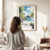 03 - Framed American Samoa National Park Watercolor Wall Art - In Living Room with Woman Looking at it - Portrait.jpg