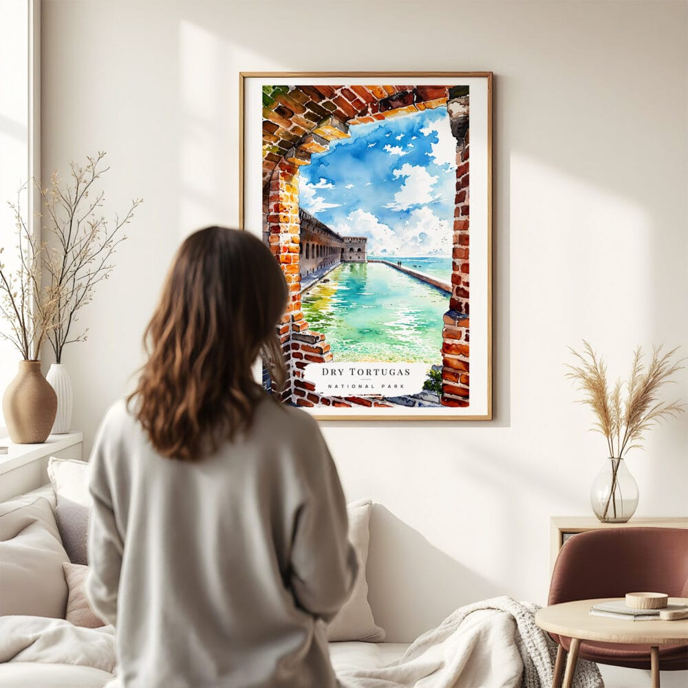 03 - Framed Dry Tortugas National Park Watercolor Wall Art - In Living Room with Woman Looking at it - Portrait.jpg 03 - Framed Dry Tortugas National Park Watercolor Wall Art - In Living Room with Woman Looking at it - Portrait.jpg