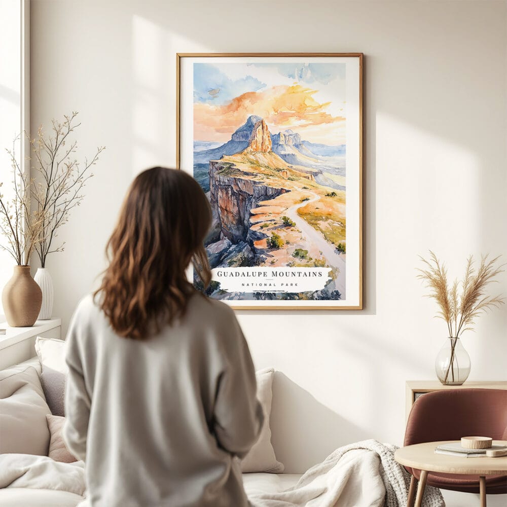 03 - Framed Guadalupe Mountains National Park Watercolor Wall Art - In Living Room with Woman Looking at it - Portrait.jpg 03 - Framed Guadalupe Mountains National Park Watercolor Wall Art - In Living Room with Woman Looking at it - Portrait.jpg