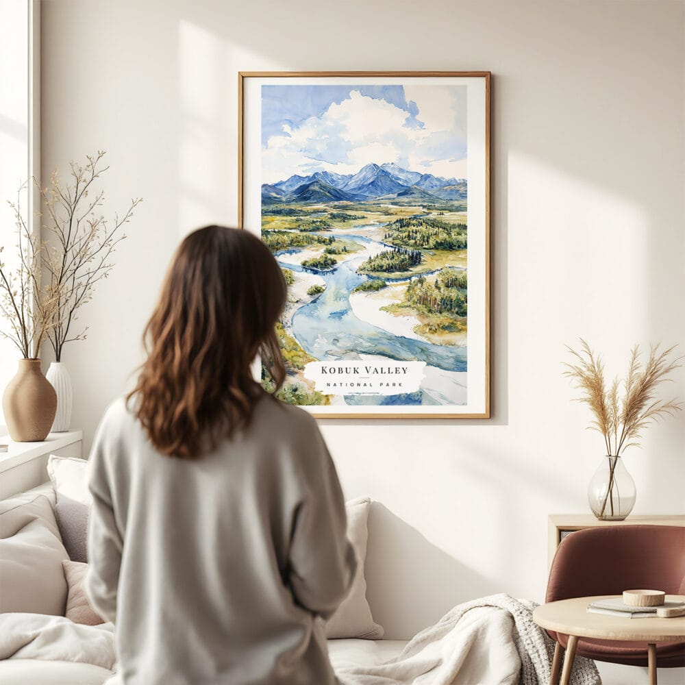 03 - Framed Kobuk Valley National Park Watercolor Wall Art - In Living Room with Woman Looking at it - Portrait.jpg 03 - Framed Kobuk Valley National Park Watercolor Wall Art - In Living Room with Woman Looking at it - Portrait.jpg