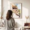 03 - Framed Mesa Verde National Park Watercolor Wall Art - In Living Room with Woman Looking at it - Portrait.jpg