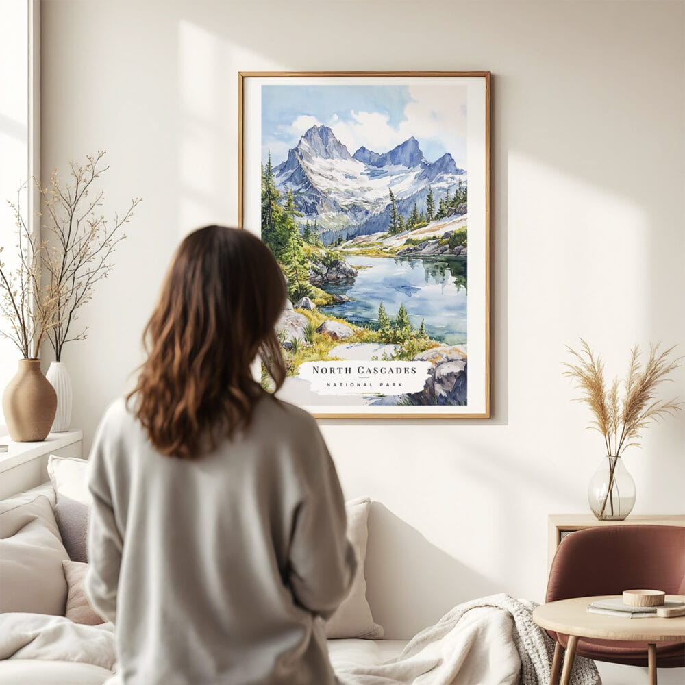 03 - Framed North Cascades National Park Watercolor Wall Art - In Living Room with Woman Looking at it - Portrait.jpg 03 - Framed North Cascades National Park Watercolor Wall Art - In Living Room with Woman Looking at it - Portrait.jpg