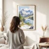 03 - Framed North Cascades National Park Watercolor Wall Art - In Living Room with Woman Looking at it - Portrait.jpg