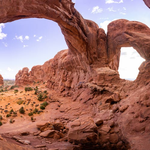 Captivating view of iconic rock formations in Arches National Park under a clear blue sky.