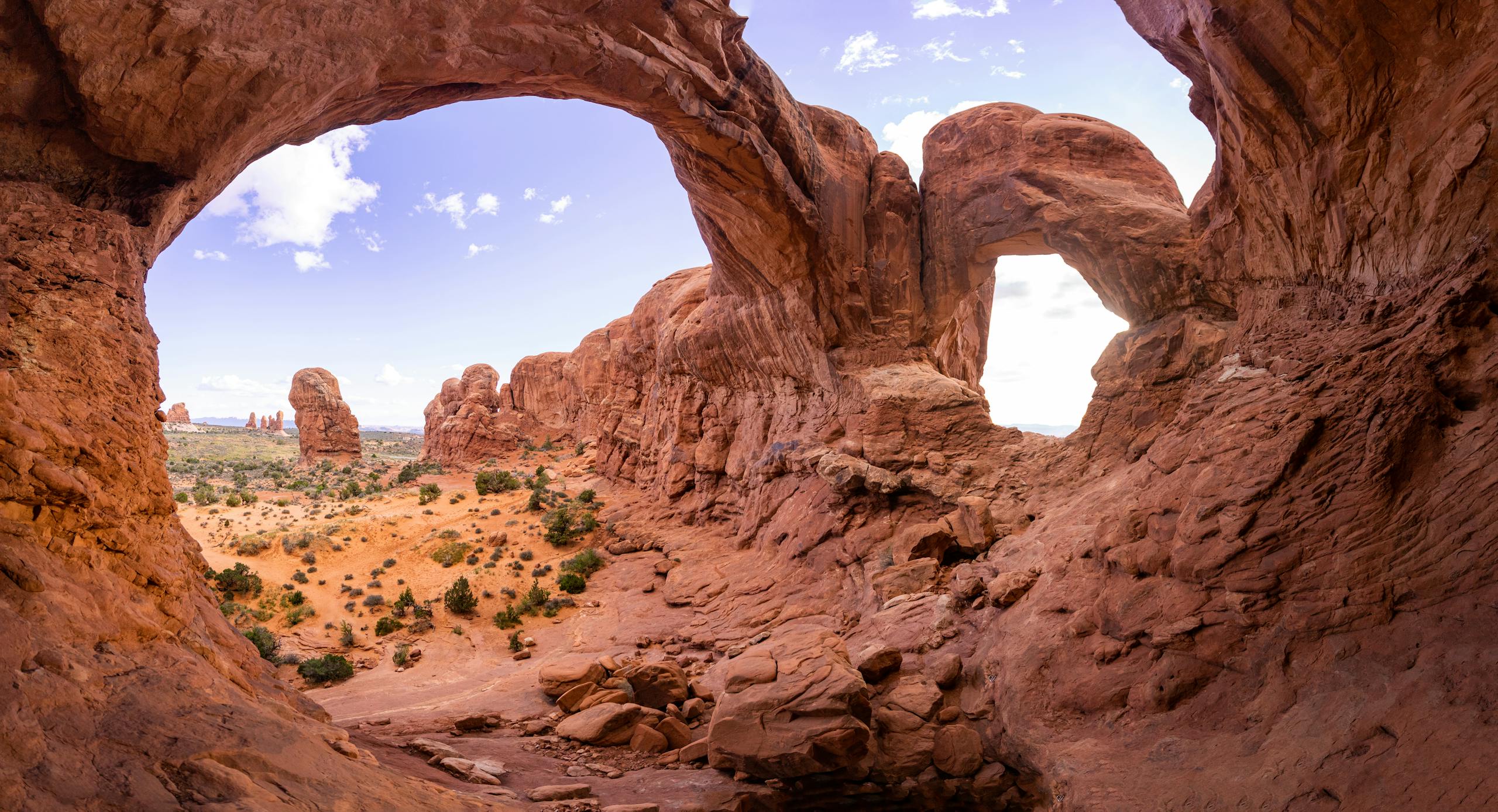 Captivating view of iconic rock formations in Arches National Park under a clear blue sky.