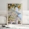 01 - Framed Morning Coffee in Amalfi Coast Watercolor Art Print leaning against couch - Vertical.jpg