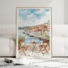 01 - Framed Morning Coffee in Porto Watercolor Art Print leaning against couch - Vertical.jpg