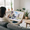 02 - A Woman Holding A Framed Big Bend National Park Watercolor - Horizontal Art Print.jpg