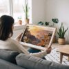 02 - A Woman Holding A Framed Grand Canyon National Park Watercolor - Horizontal Art Print.jpg