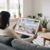 02 - A Woman Holding A Framed Lisbon Portugal Watercolor Art - Horizontal Art Print.jpg