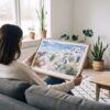 02 - A Woman Holding A Framed Santorini Watercolor Art - Horizontal Art Print.jpg