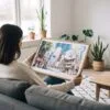 02 - A Woman Holding A Framed Tokyo Tower Watercolor Art - Horizontal Art Print.jpg