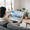 02 - A Woman Holding A Framed Wrangell–St. Elias National Park Watercolor - Horizontal Art Print.jpg