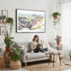 02 - Framed Badlands National Park Watercolor - Horizontal Canvas Print - Boho Living Room with Woman reading.jpg