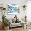 02 - Framed Banff National Park Watercolor - Horizontal Canvas Print - Boho Living Room with Woman reading.jpg