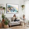 02 - Framed Big Sur Watercolor - Horizontal Canvas Print - Boho Living Room with Woman reading.jpg