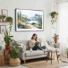 02 - Framed Glacier National Park Watercolor - Horizontal Canvas Print - Boho Living Room with Woman reading.jpg