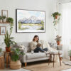 02 - Framed Grand Teton National Park Watercolor - Horizontal Canvas Print - Boho Living Room with Woman reading.jpg